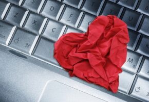 Red,Heart,Paper,On,Keyboard,Computer,Background.,Online,Internet,Romance
